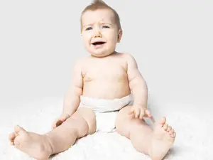 How did the baby tell her mom that she had a wet diaper?