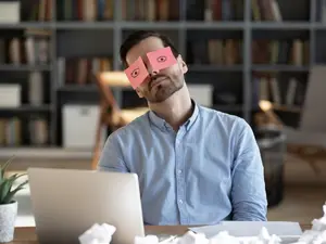 What do you call a businessman asleep in a meeting?