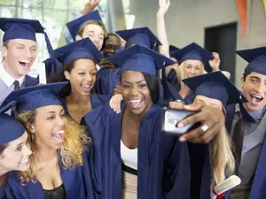 Why was the room so hot during the college graduation?